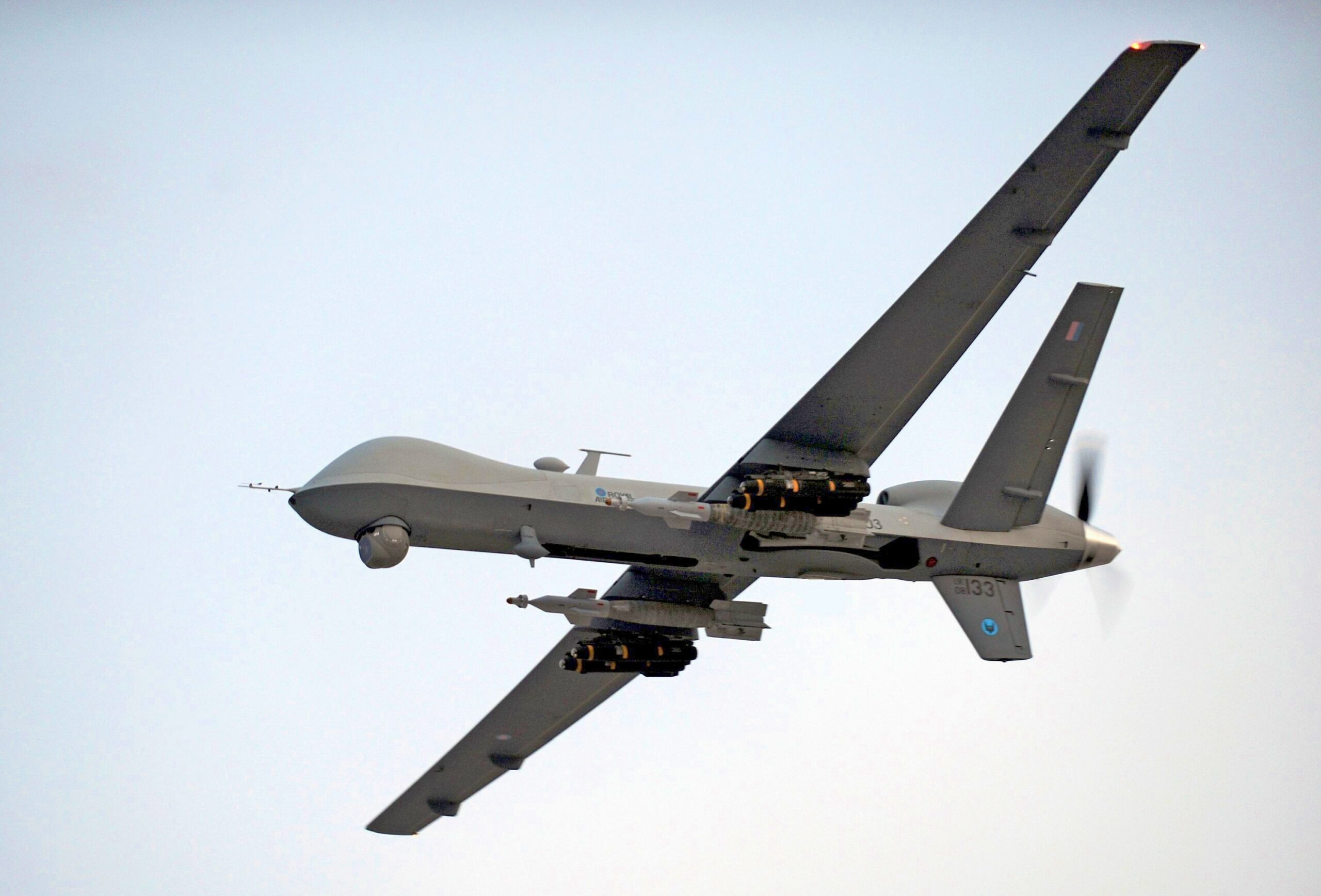 A RAF Reaper UAV (Unmanned Aerial Vehicle) is pictured airborne over Afghanistan during Operation Herrick.

It is armed with a full complement of two GBU-12 226kg (500lb) laser-guided bombs and four Lockheed Martin AGM-114P Hellfire air-to-surface missiles.

The MQ-9 Reaper is a medium-to-high altitude, long endurance remotely piloted aircraft system. The MQ-9's primary mission is to act as an intelligence, surveillance and reconnaissance (ISR) asset, employing sensors to provide real-time data to commanders and intelligence specialists at all levels.